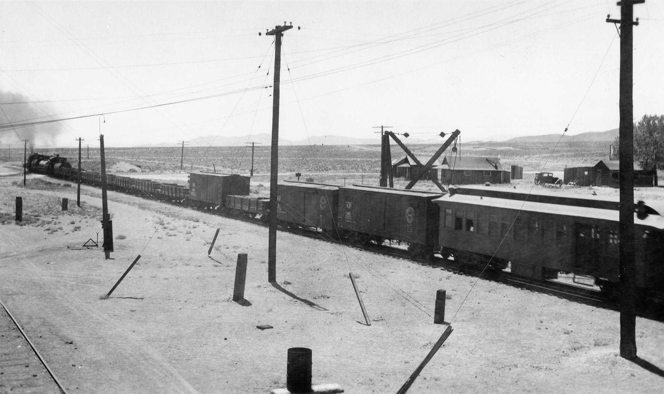 A westbound train leaves the south end of Mina in 1937.