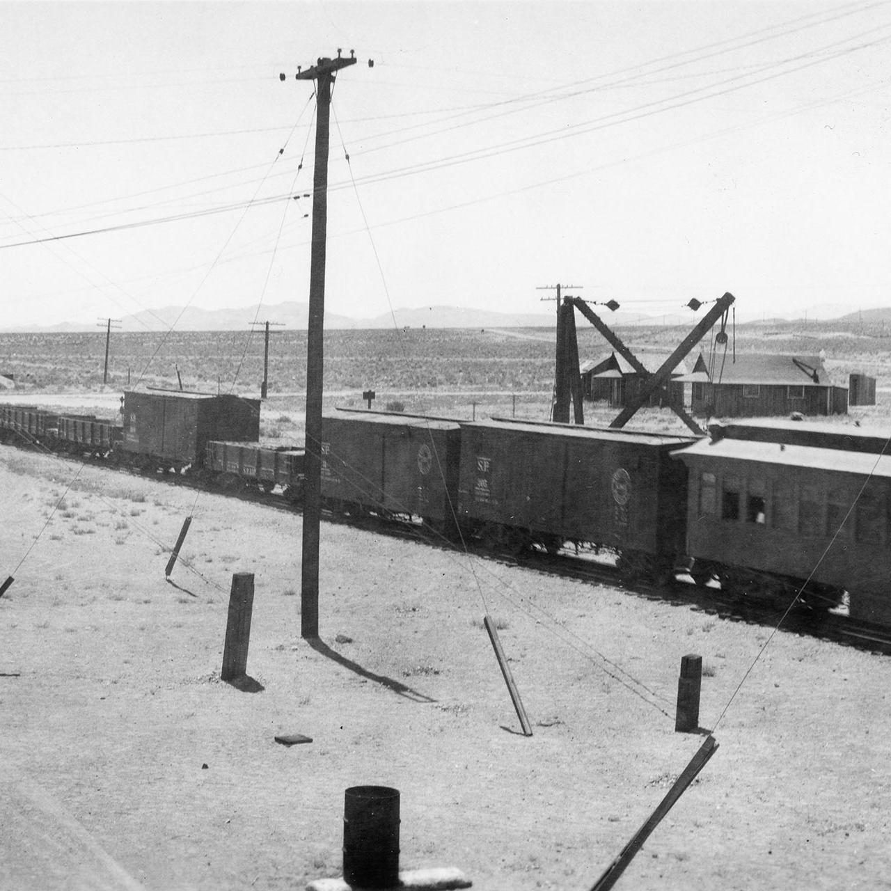 A westbound train leaves the south end of Mina in 1937.