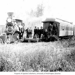 Men with locomotive and passenger car, Tanana Valley Railroad, near Fairbanks, n.d.