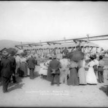 Crowd gathered around the "Aerial Swallow" at the end of the line, circa 1912.